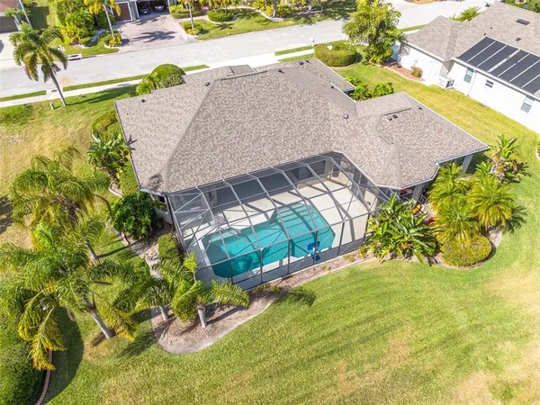 an aerial view of a house with a swimming pool