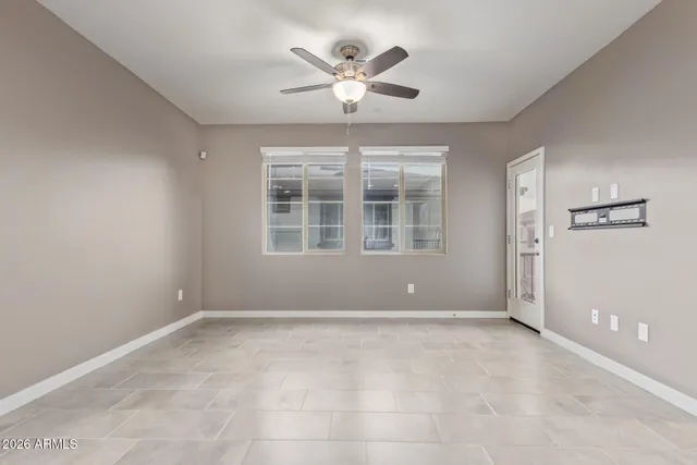 a view of a kitchen with a sink and chandelier fan