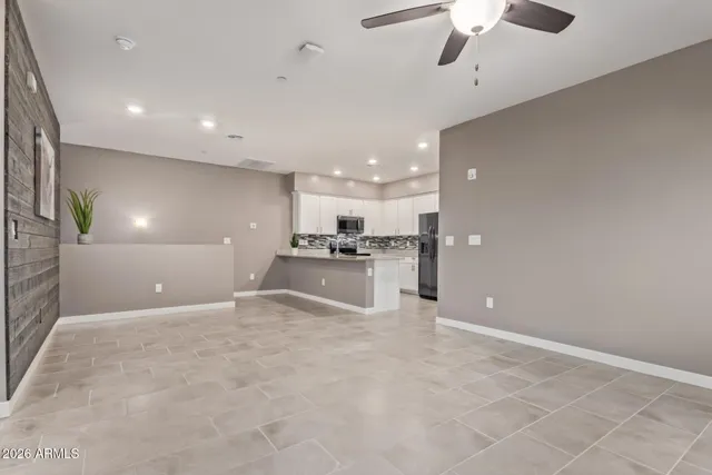 a kitchen with refrigerator and cabinets