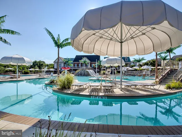 a view of a swimming pool with a patio