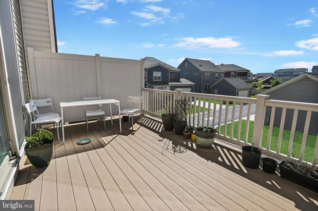 a view of balcony with deck and wooden floor