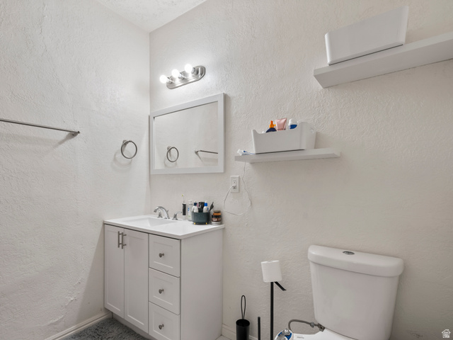 510 Canyon Road Ogden, UT 84404 - Photo 10 of 30 Bathroom featuring vanity and a textured wall