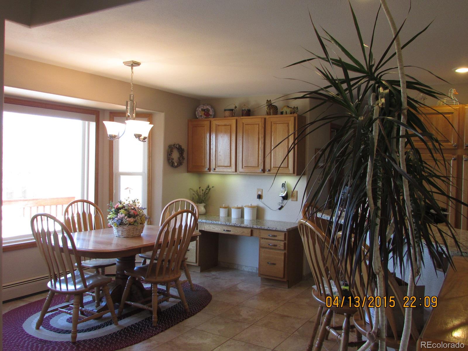 6202 Lorraine Road Larkspur, CO 80118 - Photo 12 of 35 a dining room with furniture and window