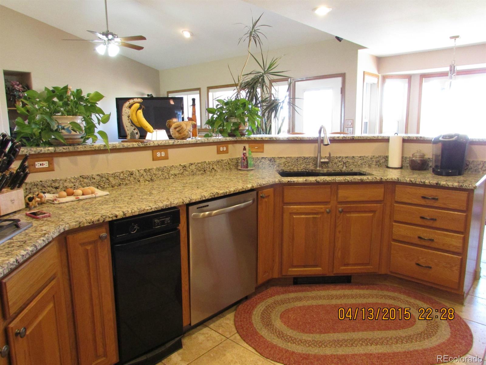 6202 Lorraine Road Larkspur, CO 80118 - Photo 14 of 35 a kitchen with a sink a stove and a window