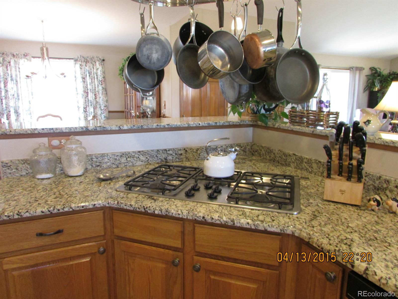 6202 Lorraine Road Larkspur, CO 80118 - Photo 15 of 35 a kitchen with a sink and a mirror