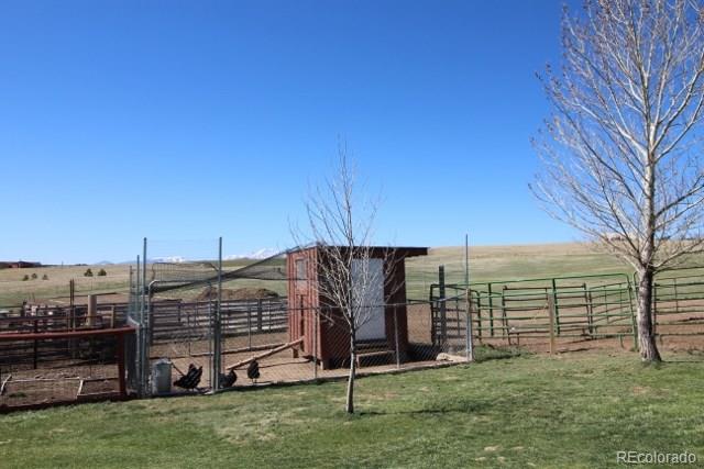 6202 Lorraine Road Larkspur, CO 80118 - Photo 21 of 35 a view of a backyard with wooden fence