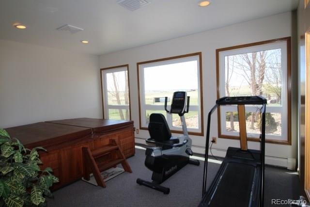 6202 Lorraine Road Larkspur, CO 80118 - Photo 34 of 35 a living room with furniture and floor to ceiling windows