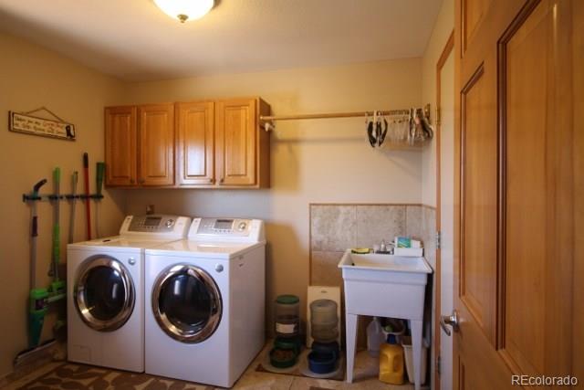 6202 Lorraine Road Larkspur, CO 80118 - Photo 35 of 35 a utility room with dryer and washer