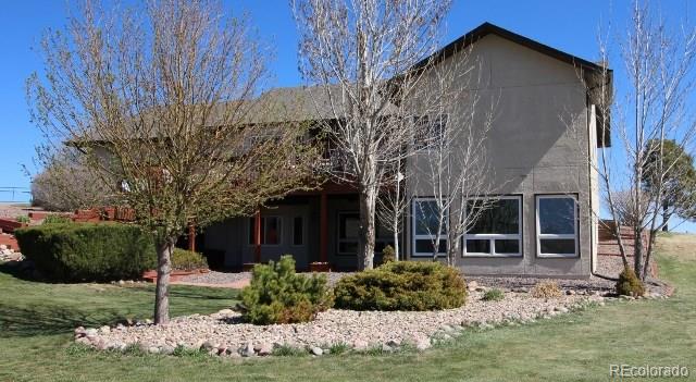 6202 Lorraine Road Larkspur, CO 80118 - Photo 5 of 35 a view of house with backyard and garden
