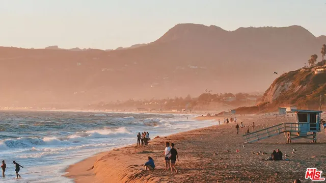 a view of an ocean and a mountain