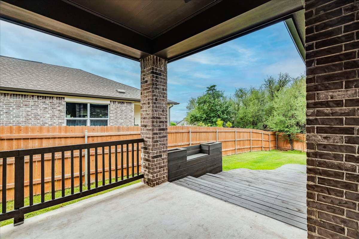 8008 Prairie Rye Drive Lago Vista, TX 78645 - Photo 29 of 40 Covered patio with concrete and wood-finish decking