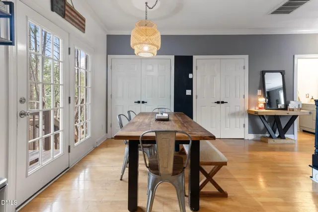 a view of a dining room with furniture window and wooden floor