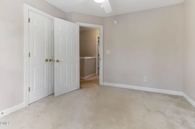 a view of a workspace with furniture and a flat screen tv