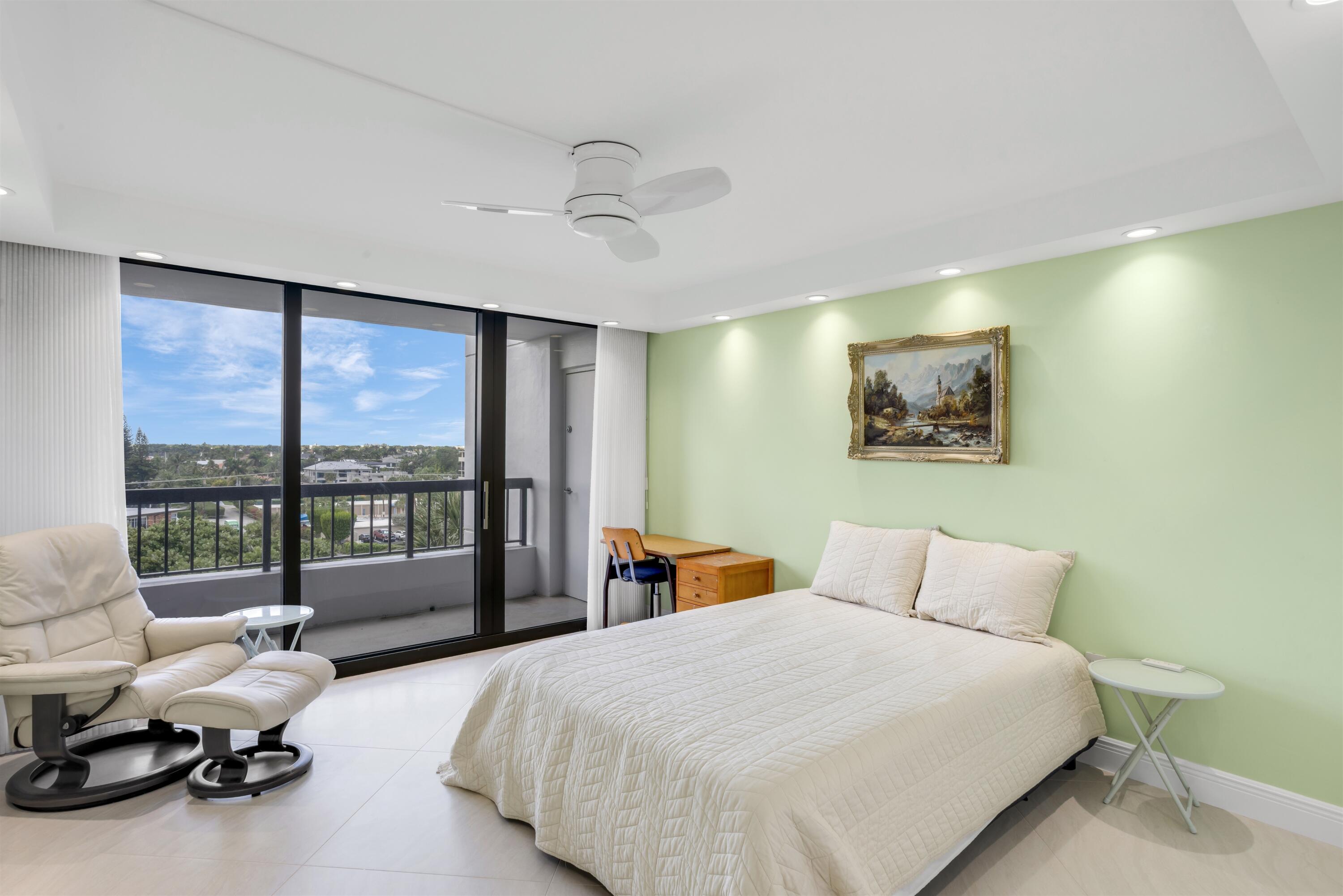 1800 South Ocean Boulevard, Unit 6B Boca Raton, FL 33432 - Photo 17 of 34 a bedroom with bed and glass window