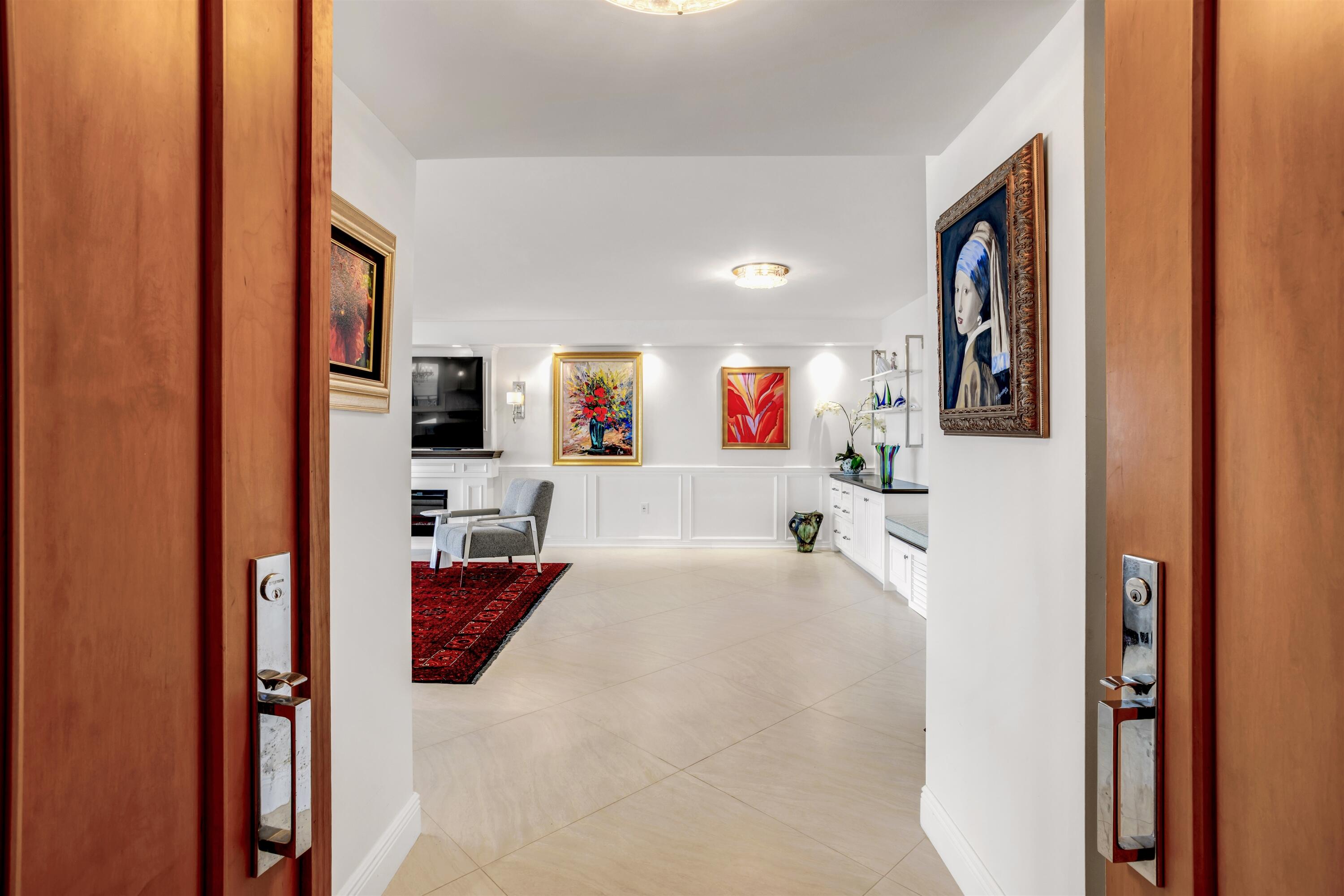 1800 South Ocean Boulevard, Unit 6B Boca Raton, FL 33432 - Photo 3 of 34 a bathroom with a tub sink and mirror