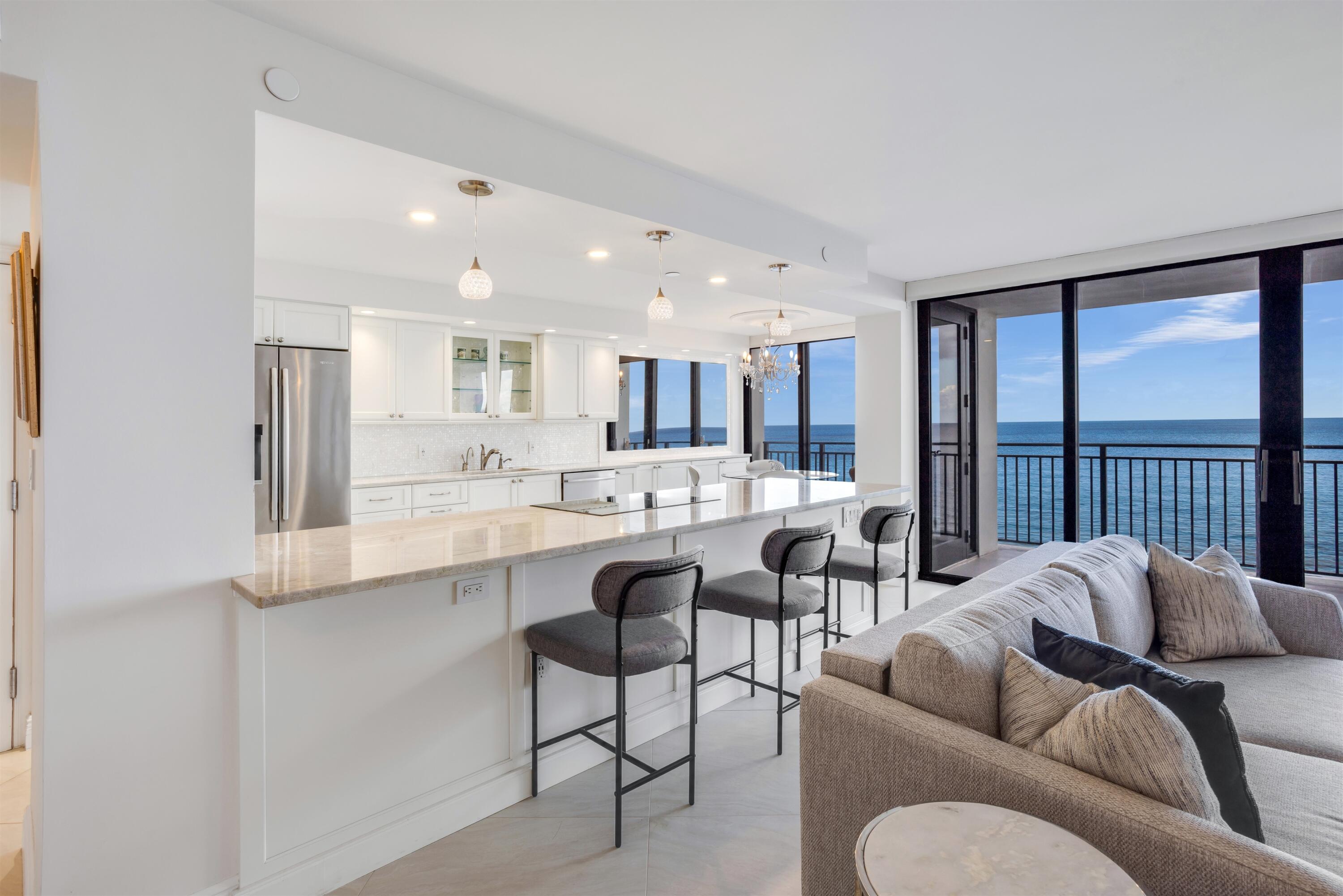 1800 South Ocean Boulevard, Unit 6B Boca Raton, FL 33432 - Photo 7 of 34 a living room with furniture wooden floor and a large window