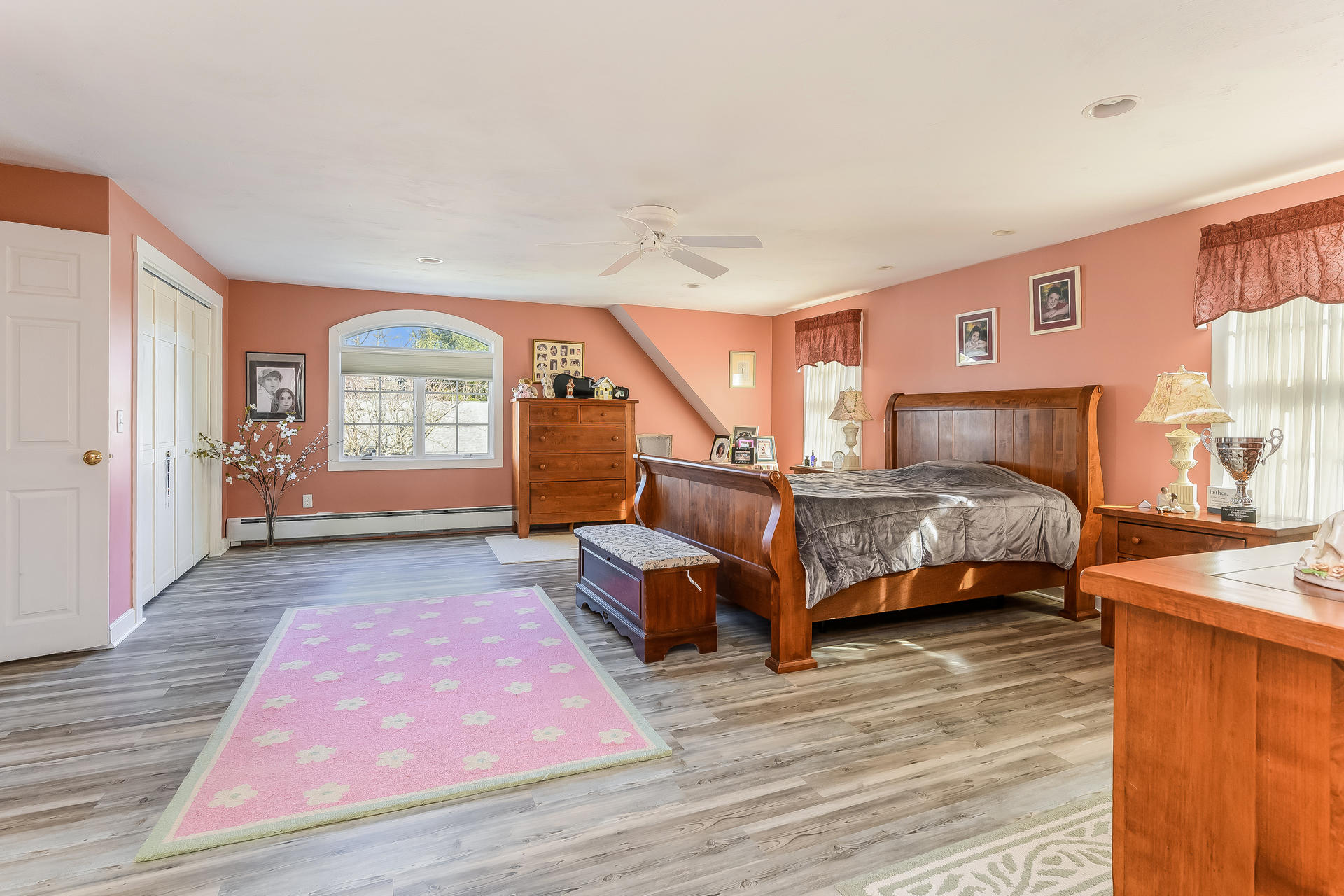 271 Pine Street Centerville, MA 02632 - Photo 8 of 22 a bedroom with furniture and a wooden floor