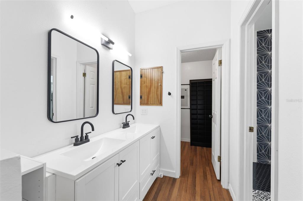 11224 Holbrook Street Spring Hill, FL 34609 - Photo 21 of 55 a bathroom with a double vanity sink mirror and double