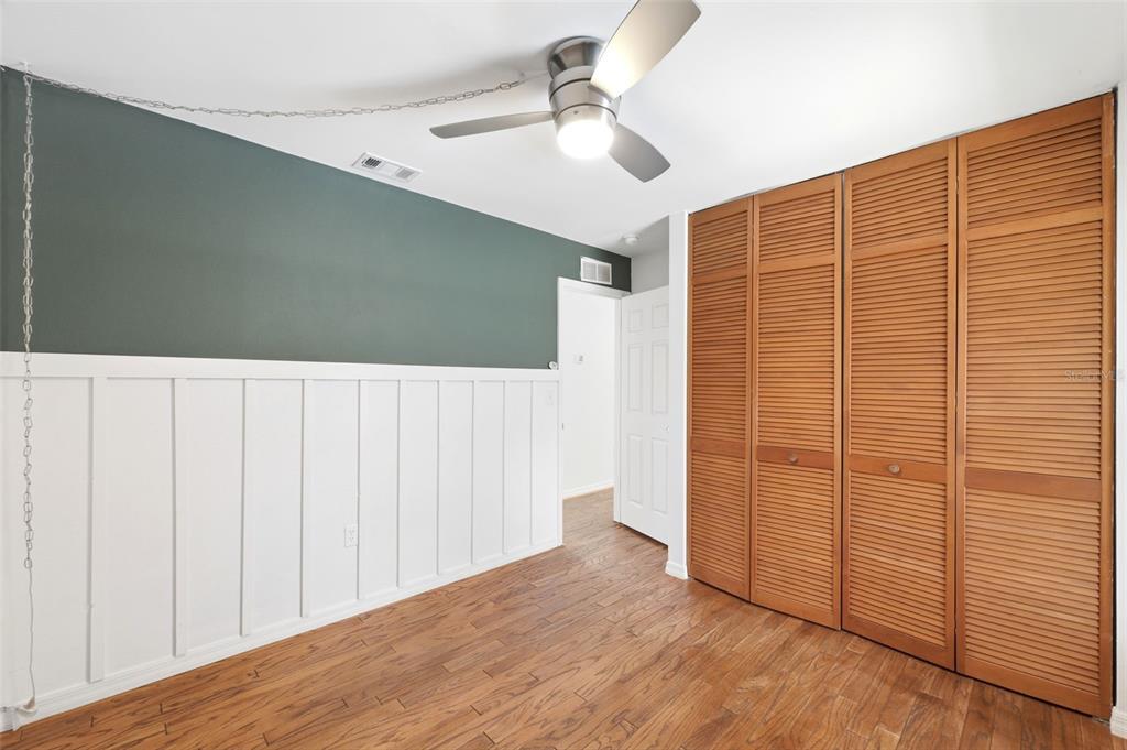 11224 Holbrook Street Spring Hill, FL 34609 - Photo 28 of 55 wooden floor in an empty room