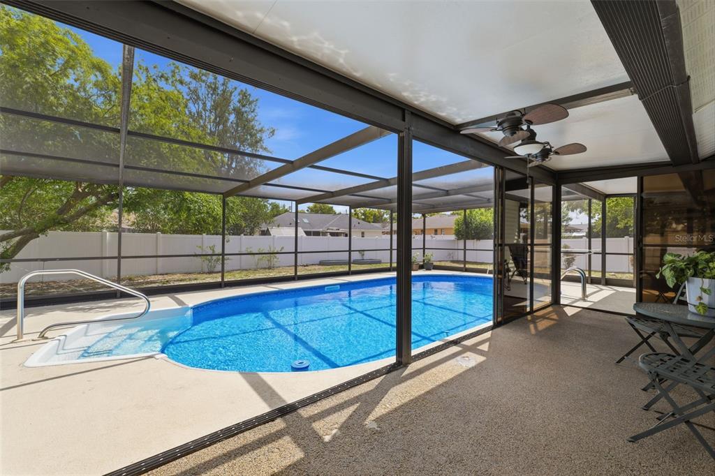 11224 Holbrook Street Spring Hill, FL 34609 - Photo 29 of 55 a view of a swimming pool with a patio