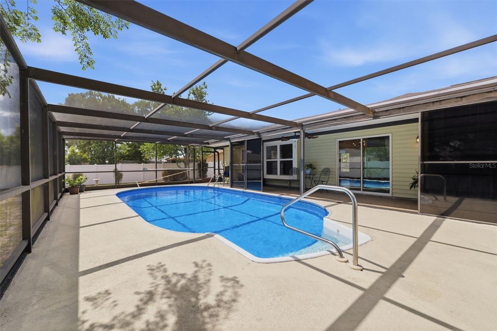 11224 Holbrook Street Spring Hill, FL 34609 - Photo 31 of 55 a view of a backyard with furniture and tub