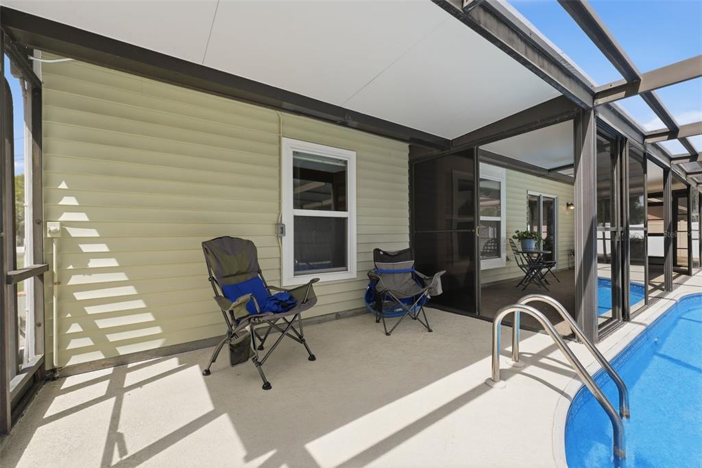 11224 Holbrook Street Spring Hill, FL 34609 - Photo 33 of 55 a work room with furniture and gym equipment