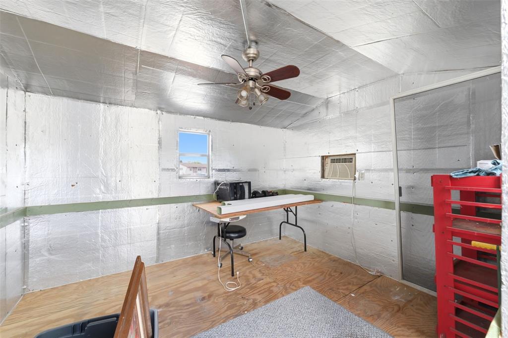 11224 Holbrook Street Spring Hill, FL 34609 - Photo 41 of 55 a workspace with chandelier