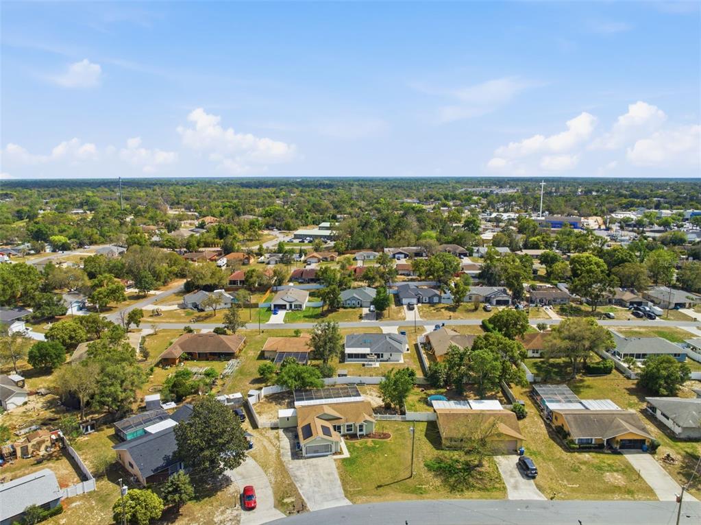 11224 Holbrook Street Spring Hill, FL 34609 - Photo 48 of 55 an aerial view of residential houses with outdoor space