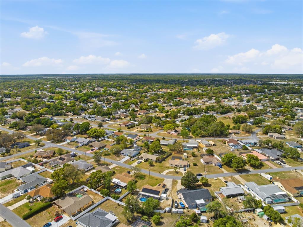 11224 Holbrook Street Spring Hill, FL 34609 - Photo 52 of 55 an aerial view of residential houses with outdoor space