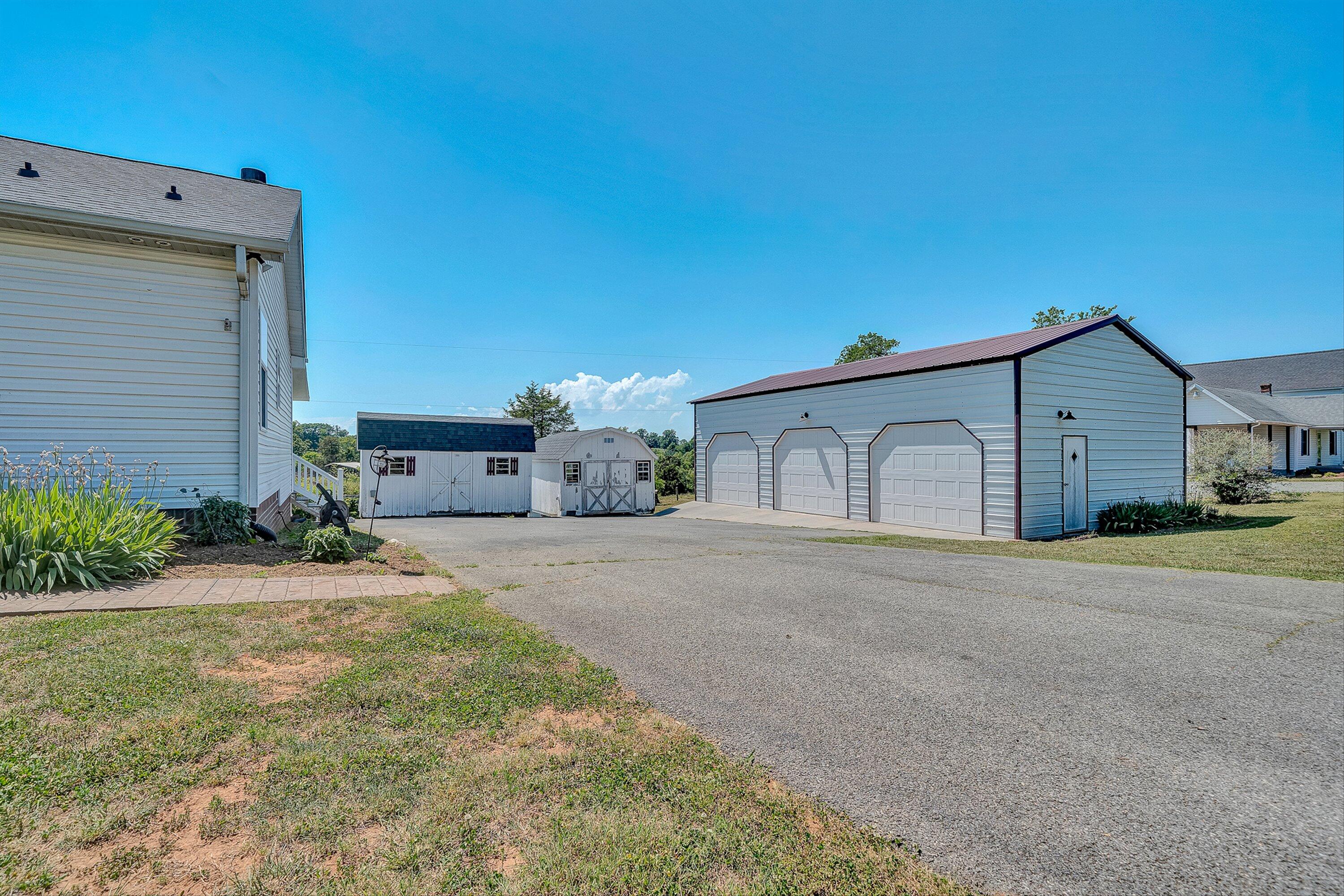 159 Simmons Creek Road Union Hall, VA 24176 - Photo 38 of 55 a front view of a house with a yard and garage