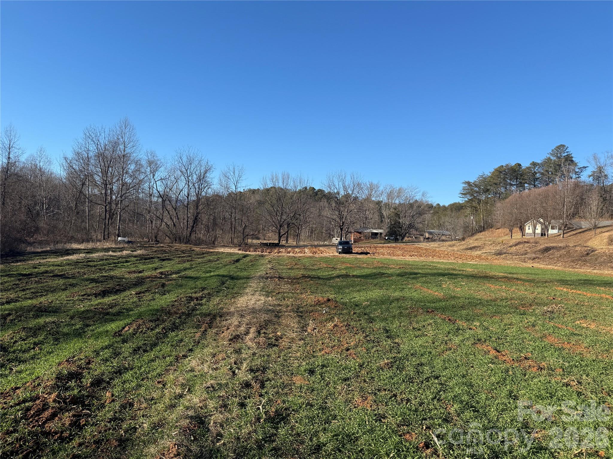 0 Old Fort Sugar Hill Road Marion, NC 28752 - Photo 15 of 35 a view of a field with a house in background