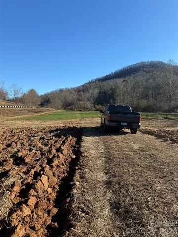 a view of a lake with mountain in the background