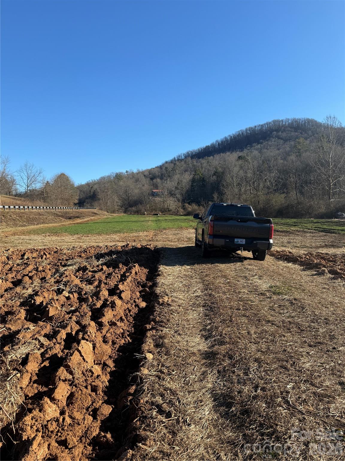 0 Old Fort Sugar Hill Road Marion, NC 28752 - Photo 2 of 35 a view of a lake with mountain in the background