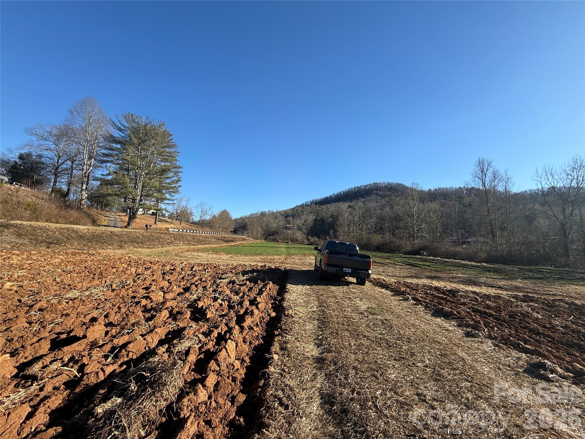 0 Old Fort Sugar Hill Road Marion, NC 28752 - Photo 5 of 35 a view of a lake with mountain in the background