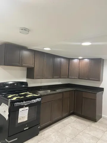 a kitchen with wooden cabinets