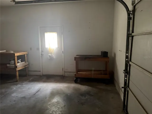 a view of a livingroom with furniture and a window