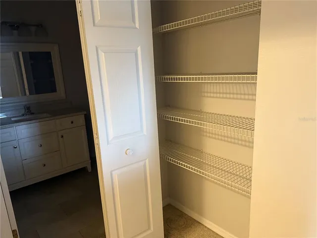 a bathroom with a shower and a sink