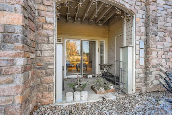 a front view of a house with outdoor seating