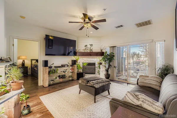 a living room with furniture and a fireplace