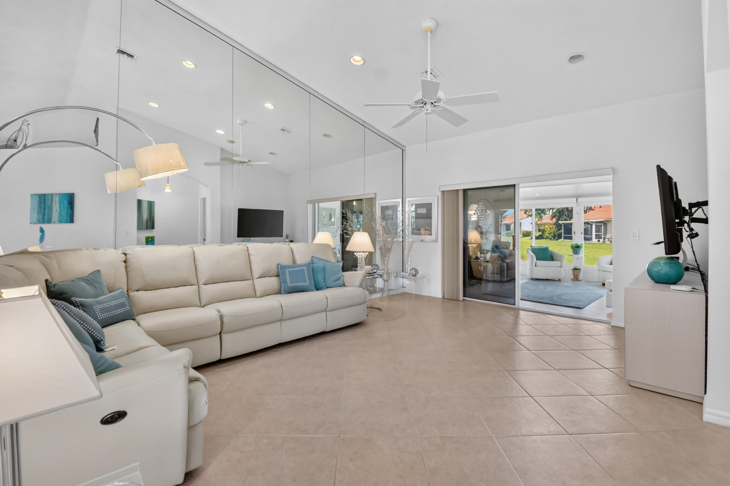 15340 Floral Club Road Delray Beach, FL 33484 - Photo 15 of 42 a living room with furniture and a chandelier