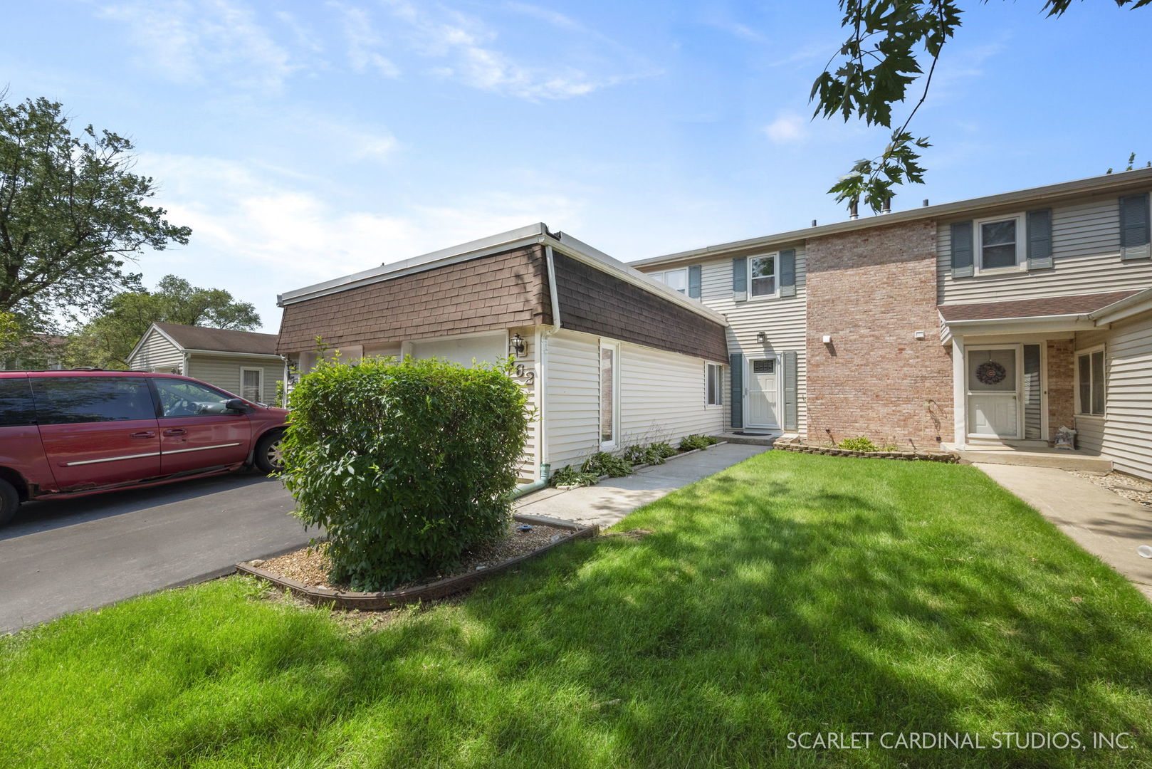 a front view of a house with garden
