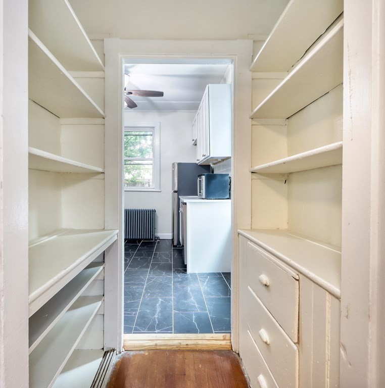 15-17 Pond Street Boston, MA 02130 - Photo 13 of 21 a view of a kitchen cabinets and a window