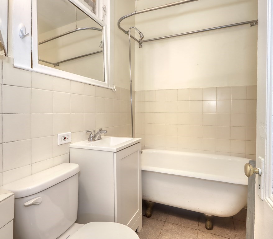 15-17 Pond Street Boston, MA 02130 - Photo 16 of 21 a bathroom with a sink toilet and shower