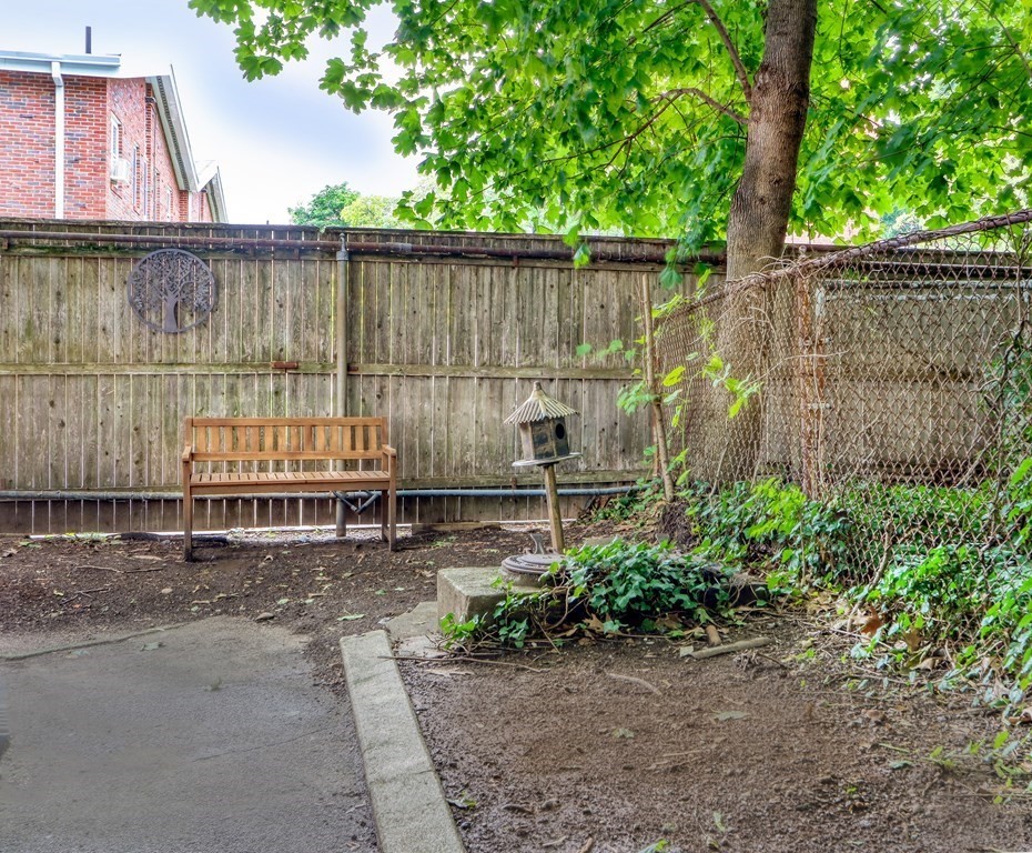 15-17 Pond Street Boston, MA 02130 - Photo 17 of 21 a backyard of a house with lots of green space