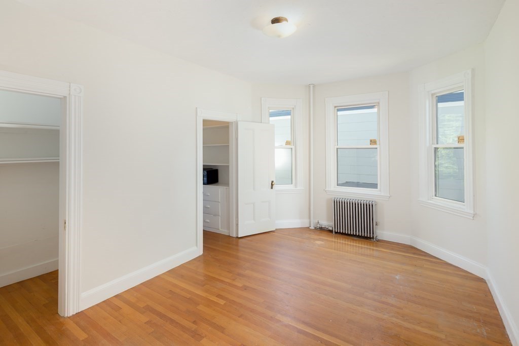 15-17 Pond Street Boston, MA 02130 - Photo 19 of 21 a view of empty room with wooden floor and fan