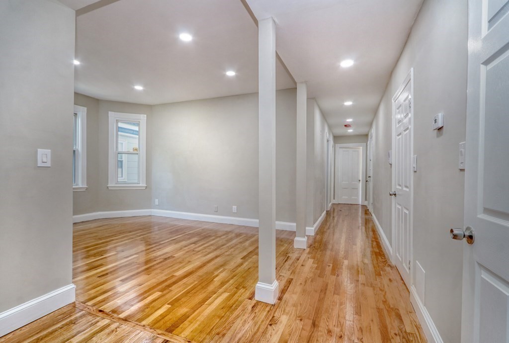 15-17 Pond Street Boston, MA 02130 - Photo 4 of 21 a view of hallway with wooden floor