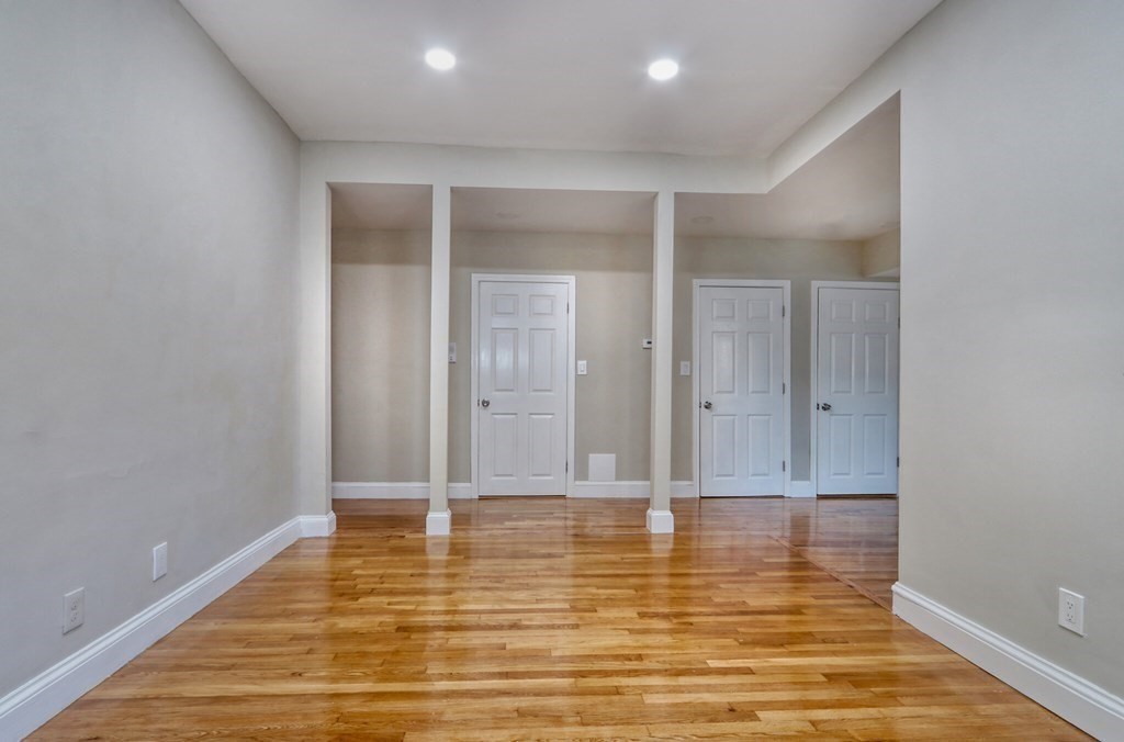 15-17 Pond Street Boston, MA 02130 - Photo 5 of 21 a view of room with window and wooden floor