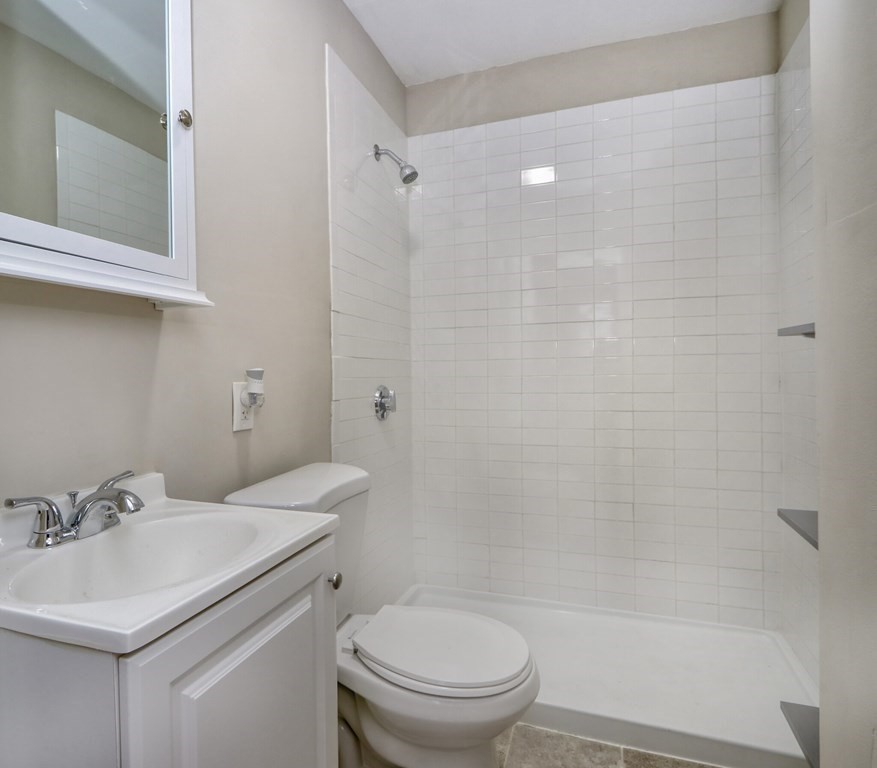 15-17 Pond Street Boston, MA 02130 - Photo 6 of 21 a bathroom with a sink toilet and shower