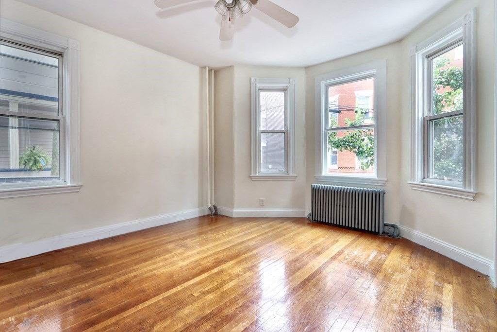 15-17 Pond Street Boston, MA 02130 - Photo 10 of 21 a view of an empty room with a window