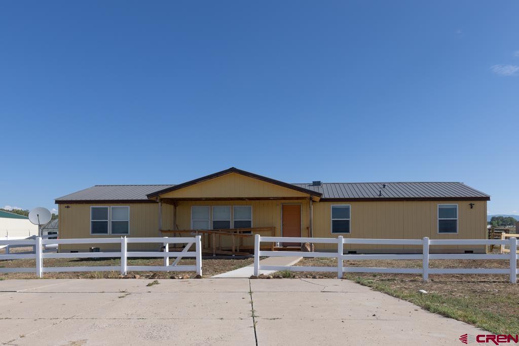 10662 Highway 172 Ignacio, CO 81137 - Photo 3 of 30 a front view of a house with a yard
